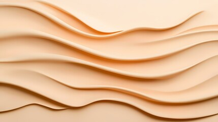 Obraz premium The image shows a close-up of a smooth, creamy, peach-colored substance with a subtle shimmer. It is arranged in gentle, flowing waves that create a sense of movement and fluidity.