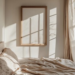A bed with a white sheet and a wooden framed picture on the wall
