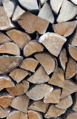 Wooden background. Stack of Split Firewood Logs for Heating