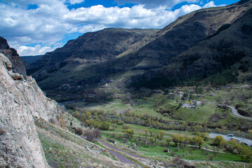 The beautiful view of a scenic valley with majestic mountains in the background