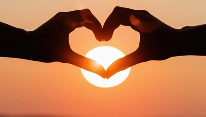 Fototapeta premium Hands in heart shape with sun rise background, love concept