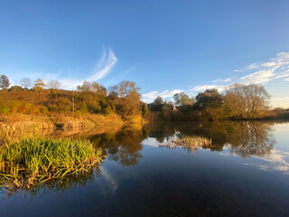 small lake autumn landscape sunny autumn day change colors. Autumn landscape. Beautiful warm colors