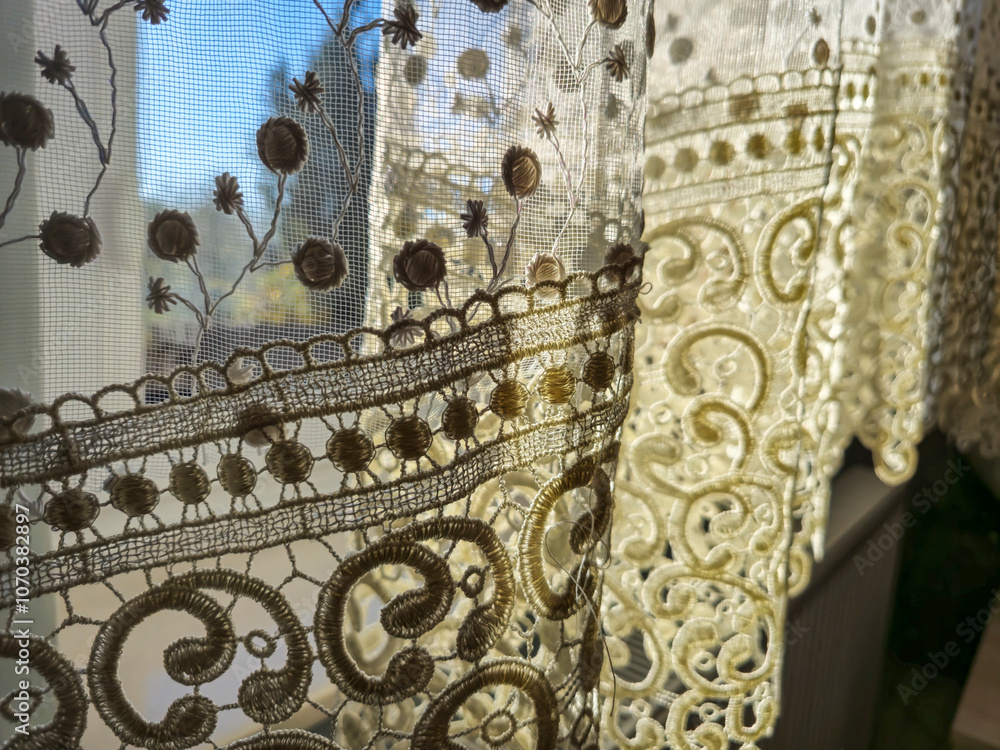 Poster delicate lace curtains gently illuminated by sunlight, creating a warm and inviting atmosphere in a 