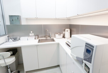 Sterilizing medical instruments in modern clinic room