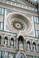 Santa maria del fiore cathedral facade showing rose window and statues
