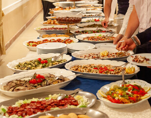Chefs preparing dishes for a sumptuous buffet in a restaurant or hotel