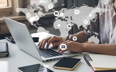 Global Connectivity: A person working on a laptop with a world map and communication icons overlayed, symbolizing global reach and interconnectedness.  