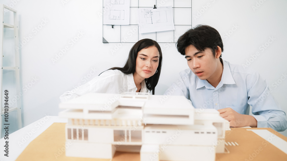 Aufkleber closeup of skilled architecture engineer team measure and decide house model while working together 