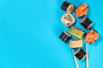 Creative sushi set background containing sushi rolls, maki, gunkan