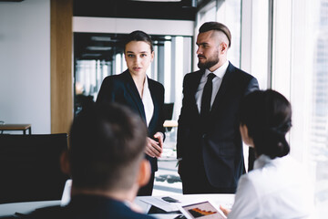 Colleagues having discussion in office