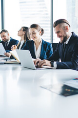 Group of colleagues with gadgets on meeting