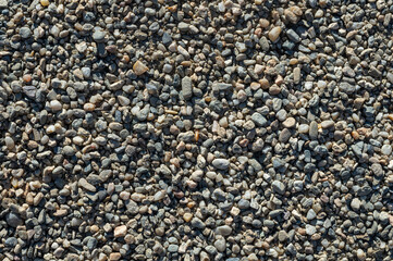 Background with texture of pebbles, small gravel raw material in the manufacture of concrete.