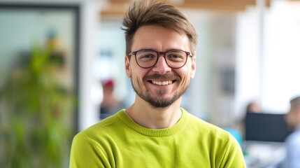 Portrait of a smiling software architect at work in a casual office setting