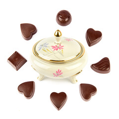 Porcelain vintage bonbonniere and set of chocolates isolated on white. Collage.