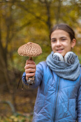 Mushrooms umbrellas in hands. Selective focus.