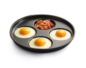 fried egg and bacon in a frying pan