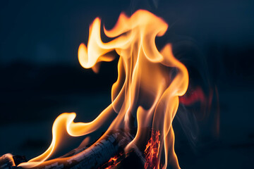 Bright orange flame against black, swirling in intense patterns