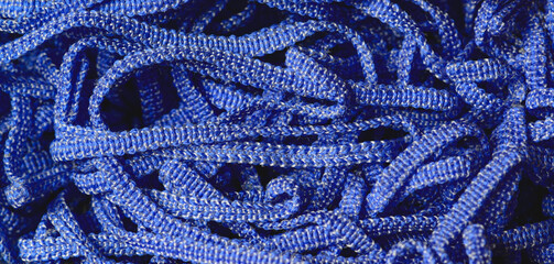 Detail of blue fuzzy rope resting in coil