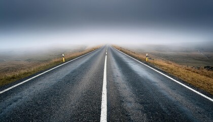Naklejka premium A long, empty road stretching into a foggy distance, symbolizing uncertainty, indecision, or a lack of direction