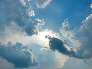 Fototapeta premium Dramatic blue sky with Puffy clouds and sun