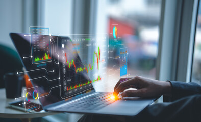 A businessman uses a laptop to access an AI-powered business analytics dashboard, showcasing...