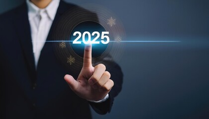 Fototapeta premium Businessman touching to virtual start button icon with 2025 new year to start 