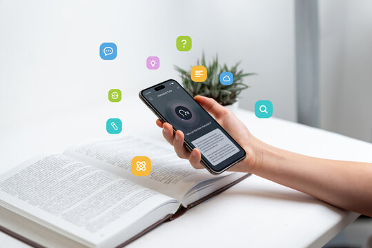 Hand holding smartphone above open book, using voice-to-text app for learning, representing audio search and text-to-speech technology, with floating icons for study and communication concepts