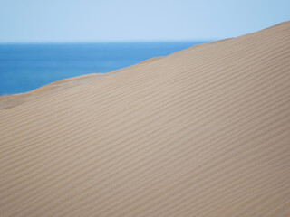 Sand textured pattern with copy space close up in Maspalomas, Gran Canaria. Abstract background...