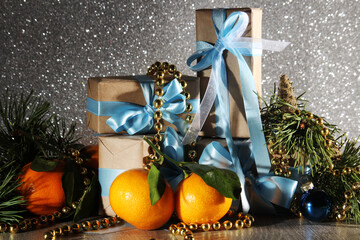 Gift boxes wrapped in craft paper with blue satin ribbons	