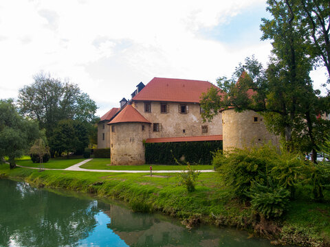 Beautiful, historic Otocec castle. Slovenian national monument. Imposing ancient fortification on a small island on the tranquil Krka river. The fortress is now a luxury hotel.