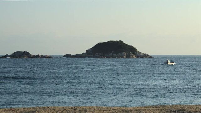 Jukdo Island and Fishing Boat off Bongpo Beach