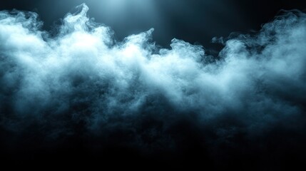 Fototapeta premium Blue smoke illuminated by a spotlight on a black background.