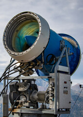 A large snow cannon positioned outdoors in a mountainous area, bariloche, rio negro, argentina