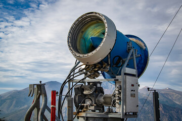 A large snow cannon positioned outdoors in a mountainous area, bariloche, rio negro, argentina