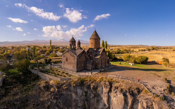 Aerial top view of Saghmosavank Monastery (13h centuries) is located huge gorge canyon of Kasakh River. Church and Mount Ara on beckground in sunny summer day. Saghmosavan, Aragatsotn, Armenia, Europe