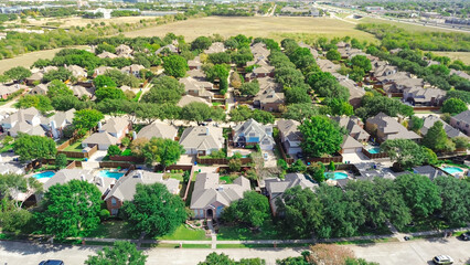Suburban neighborhood with vacant land to grow urban expansion outside downtown Plano, Texas,...