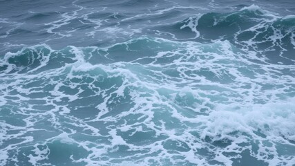 Obraz premium Agitated sea waves crashing against each other, creating a natural texture of foam and spray, stormy, rough