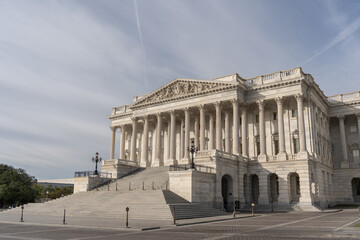 House of Representatives wing of the United States Capitol Complex with blue sky background