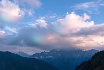 Images of mountains with iridescent clouds overhead where the cl
