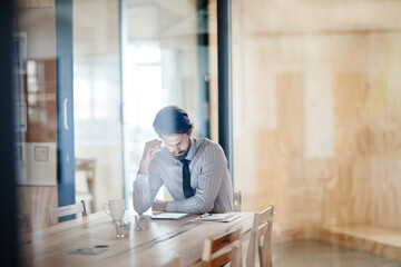 Planning, reading and tablet with business man for chief financial officer, corporate and annual report. Online, technology and company review with person in office for economy forecast and auditor