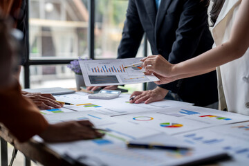 Business people having meeting and analyzing financial chart documents