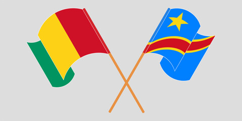Crossed and waving flags of Guinea and Democratic Republic of the Congo. Vector illustration