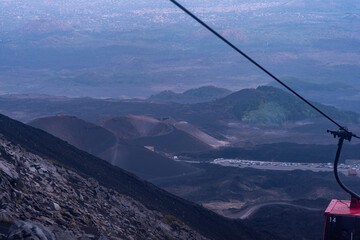 View from the Mount Etna, ctive stratovolcano in Catania, Sicily region. It is one of the tallest active volcano in Europe. Travel and sightseeing journey concept.