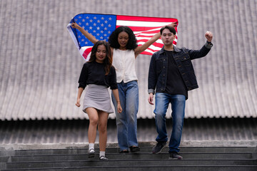Diverse group of friends proudly holding an American flag outdoors, symbolizing unity and patriotism. Their smiles and casual poses embody freedom, friendship, and the spirit of togetherness.