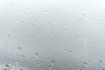 Raindrops on window glass. Rainy weather.