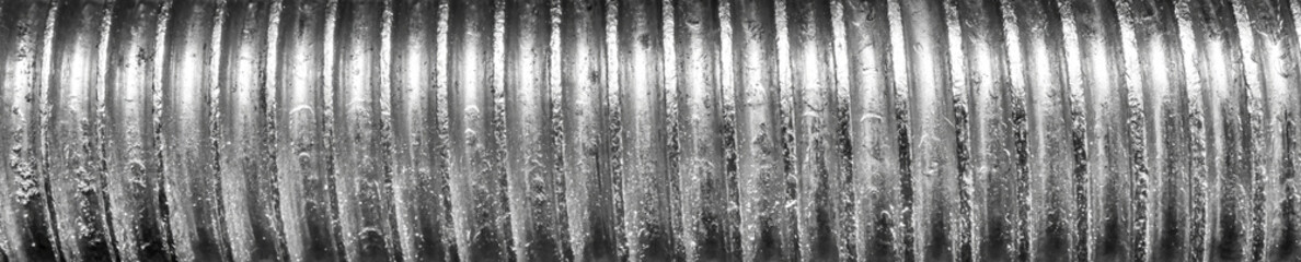 Texture of metal bolt thread. Abstract banner.