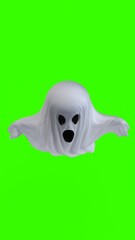 ghost in a white sheet with green background