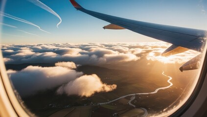 Aerial view of sunrise through airliner window in the morning. Aerial view of Cloudscape in dawn through plane window. Travel and vacation concept