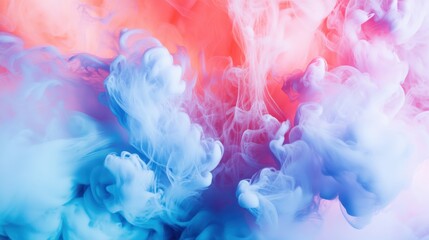 Fototapeta premium Colorful abstract smoke in vibrant pink and blue hues, creating a dreamy and ethereal atmosphere.