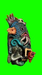 painted tiki mask with green background